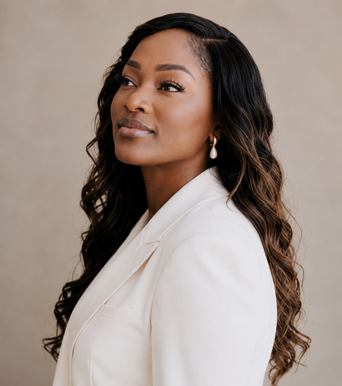 Ejiro Obayomi in a white suit in side profile